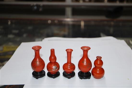 A group of four Chinese lacquer wood miniature vases and a similar pottery double gourd vase (5)